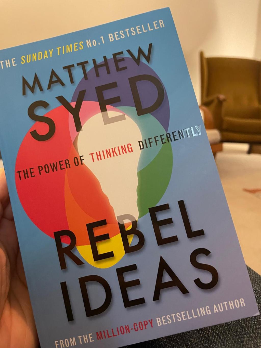 Book cover with multi-coloured light bulbs